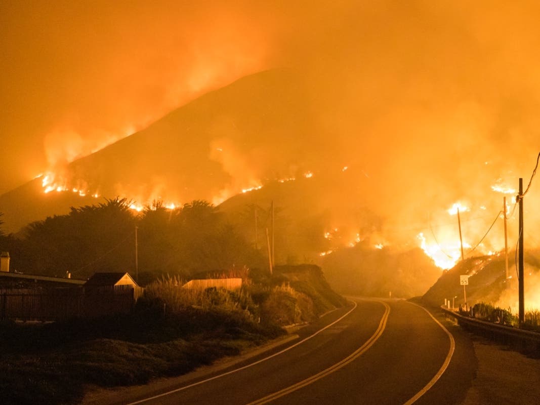 The Colorado Fire burns along Highway 1 near Big Sur, Calif., Saturday, Jan. 22, 2022.