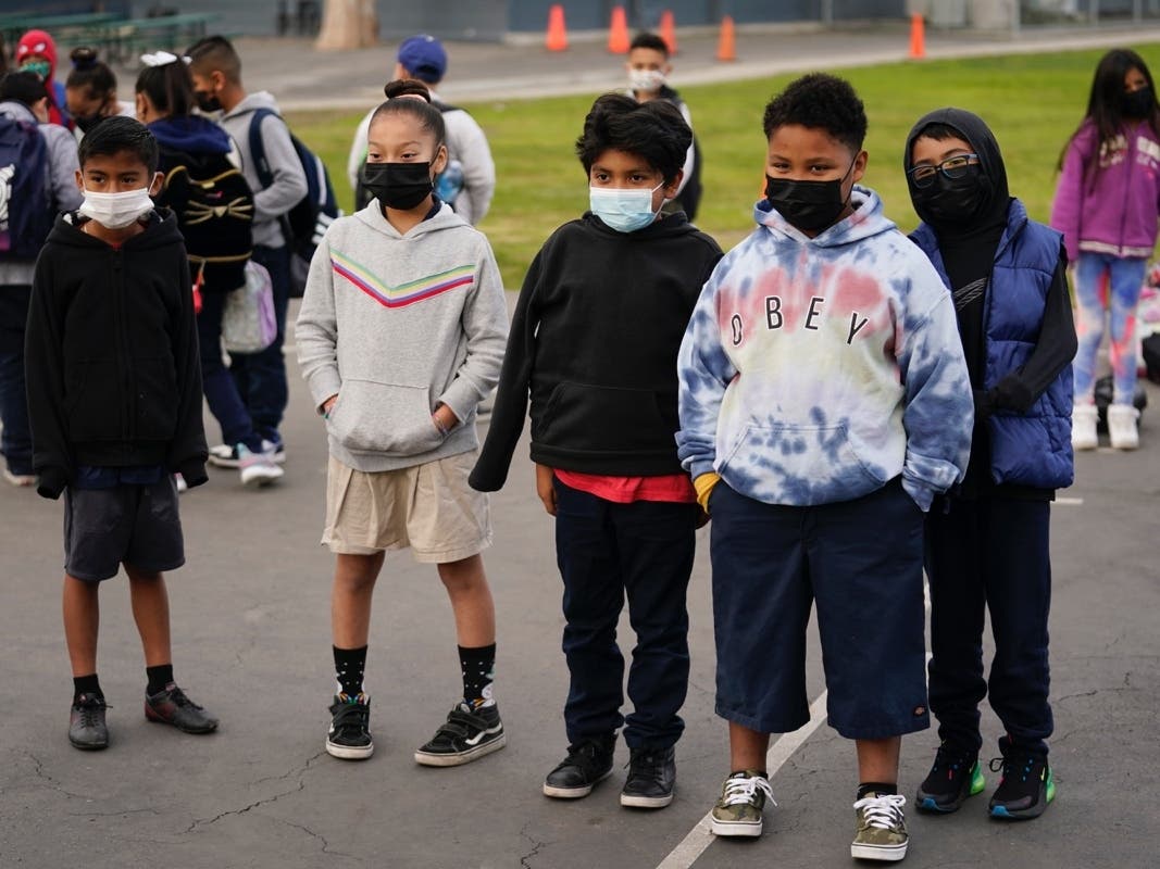 Students wait for class to start amid the COVID-19 pandemic at Washington Elementary School in Lynwood, Calif. 