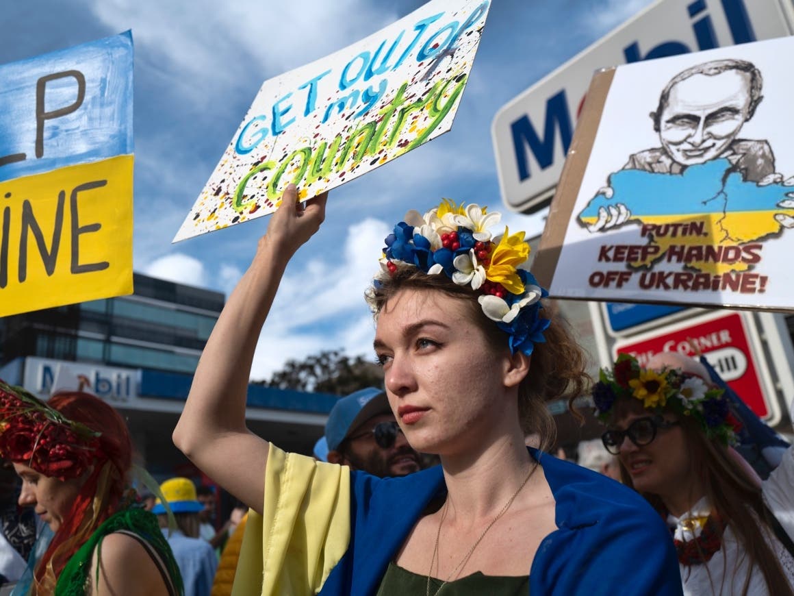 A Ukrainian protester holds a sign during a demonstration against the Russian invasion of Ukraine in Los Angeles, Saturday, Feb. 26.