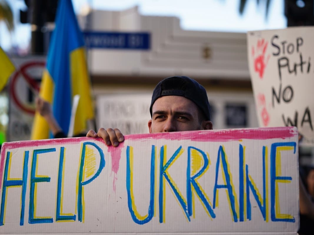 Dmytro Stasyshen, 27, of Ukraine, holds a sign to protest the Russian invasion of Ukraine during a rally in the Hollywood section of Los Angeles.