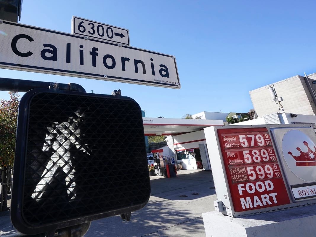 A California street sign is shown next to the price board at a gas station in San Francisco, on March 7, 2022. . Nationwide, the highest average price for regular-grade is in the San Francisco Bay Area.