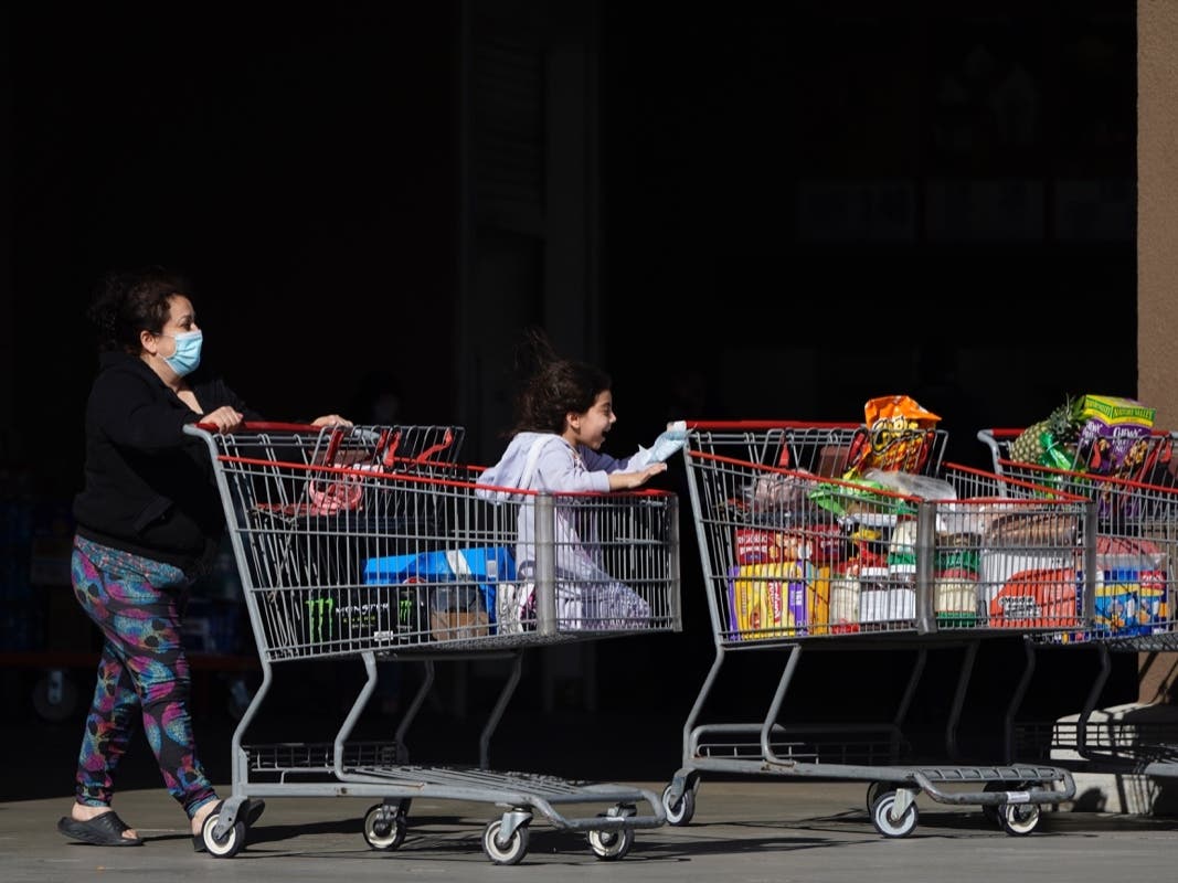 Shoppers exit a Costco in Santa Clarita, Calif.