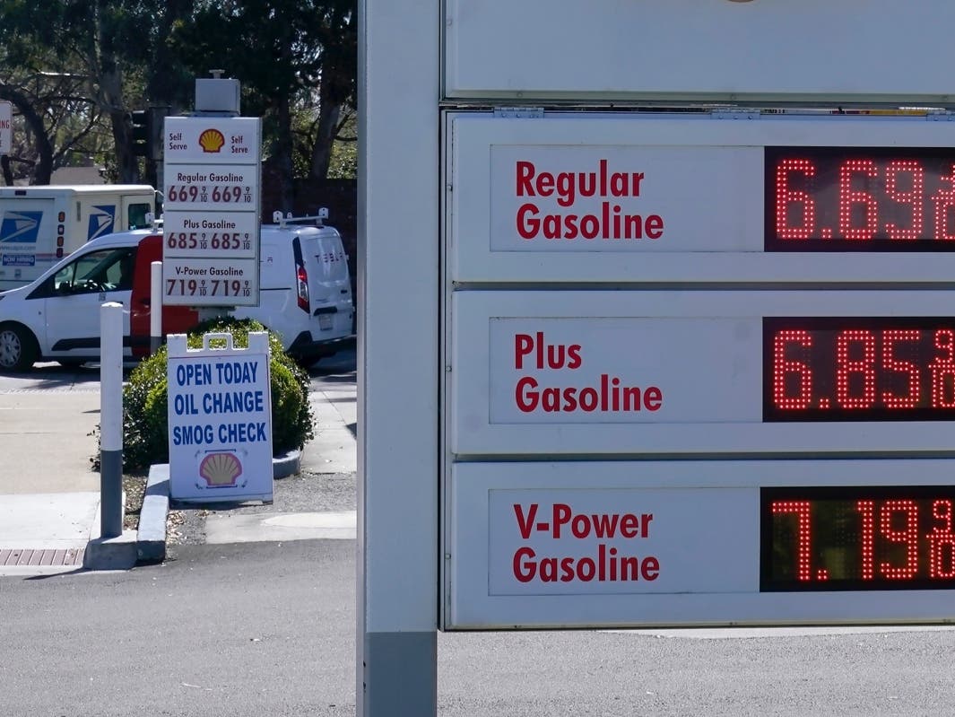 The gasoline price board is shown at a gas station in Menlo Park, Calif., March 21, 2022.