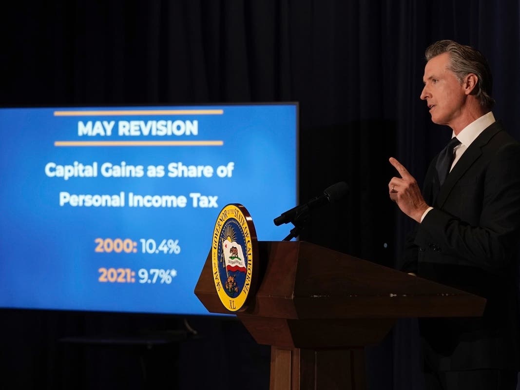 California Gov. Gavin Newsom outlines his revised 2022-2023 state budget at a news conference in Sacramento Friday.