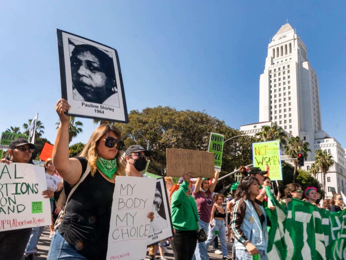 Abortion-rights activists march next to City Hall in downtown Los Angeles on Monday.