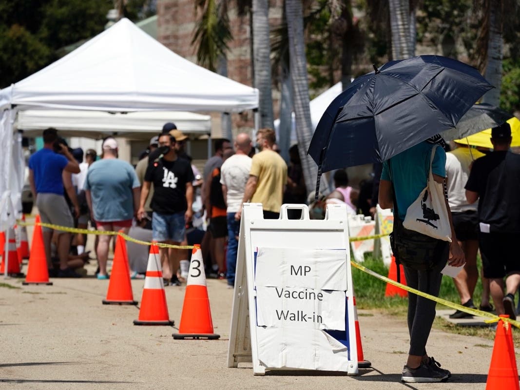 People line up at a monkeypox vaccination site on Thursday, July 28, 2022, in Encino, Calif. California's public health officer said they are pressing for more vaccine and closely monitoring the spread of the monkeypox virus. 