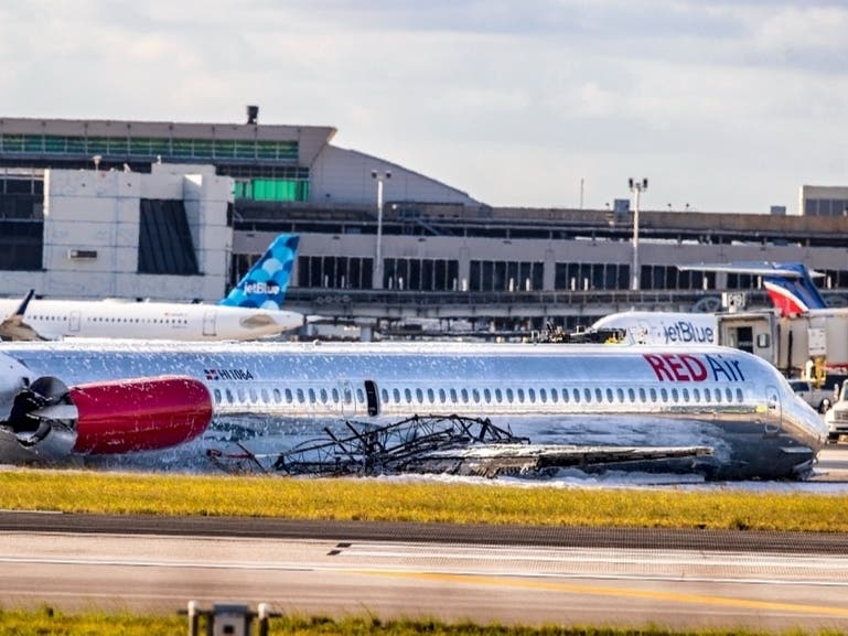 Three passengers were treated for minor injuries in South Florida after a Red Air flight from the Dominican Republic crash landed, caught fire at Miami International Airport, officials said.