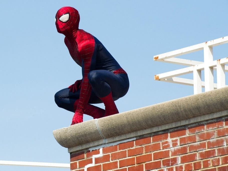 A Hollywood man dressed as Spider-Man hit a woman in the back of the head and stole $45 from her Monday night.