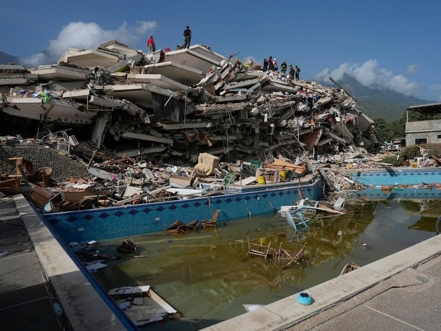 Born and raised in Venezuela, the owner of Carupano Kitchen in St. Pete is collecting items needed for the country's earthquake relief and recovery. Pictured, rescue workers search through the rubble three days after earthquakes struck Catia La Mar. 
