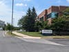 If you happen to approach from the north (not recommended), then you will see this view of the building. Many buildings in this office park look like this one. The building # is up in the air, perhaps blocked from your view by the roof of your car. 