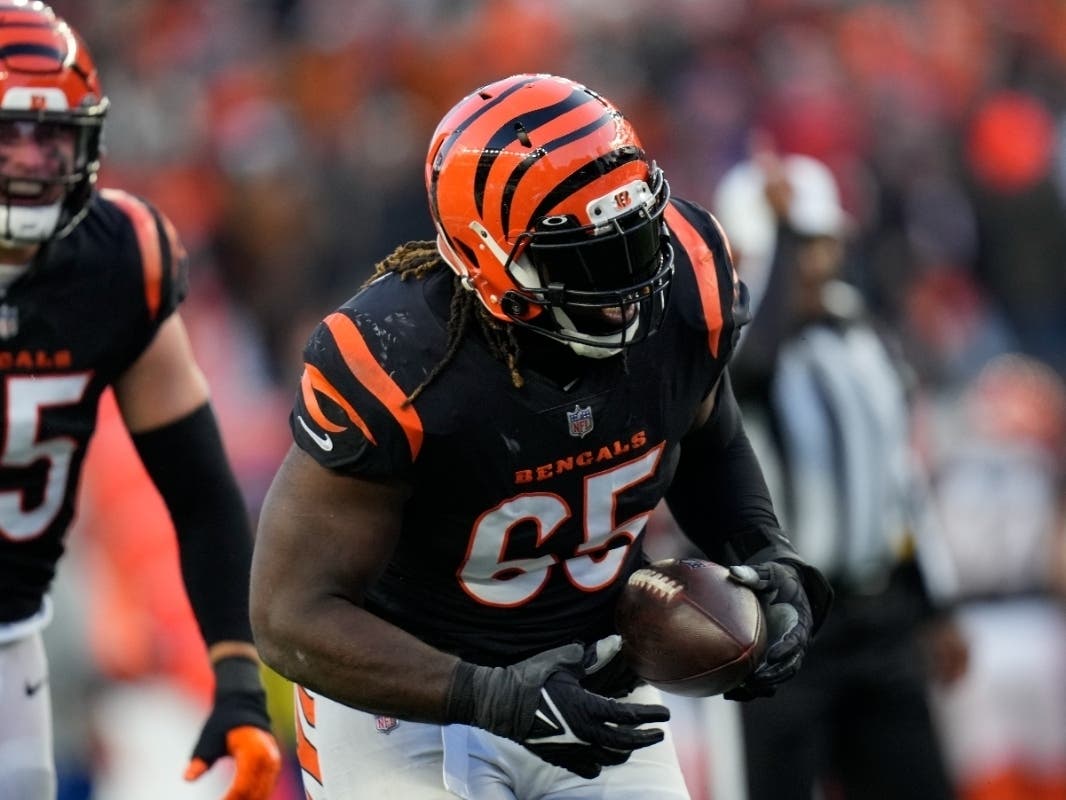Former Cincinnati Bengals defensive tackle Larry Ogunjobi runs after recovering a fumble during the first half of an NFL wild-card playoff football game against the Las Vegas Raiders on Jan. 15 in Cincinnati.