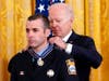 President Joe Biden awards Stamford Firefighter John Colandro the Public Safety Officer Medal of Valor in the East Room of the White House, Monday, May 16, 2022, in Washington.