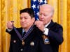 President Joe Biden awards Stamford Firefighter Michael Rosero the Public Safety Officer Medal of Valor in the East Room of the White House, Monday, May 16, 2022, in Washington.