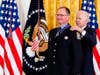 President Joe Biden awards Stamford Firefighter Chad Titus the Public Safety Officer Medal of Valor in the East Room of the White House, Monday, May 16, 2022, in Washington. 