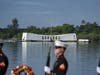 U.S. Marines fire a salute in front of the USS Arizona Memorial during the 82nd Pearl Harbor Remembrance Day ceremony on Thursday, Dec. 7, 2023, at Pearl Harbor in Honolulu, Hawaii. 