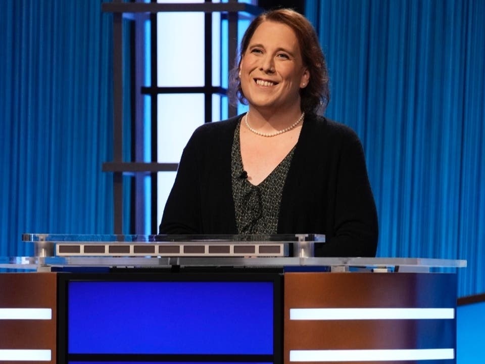 This image provided by Jeopardy Productions, Inc. shows game show champion Amy Schneider on the set of "Jeopardy!" Schneider is the first trans person to qualify for the show's Tournament of Champions. 