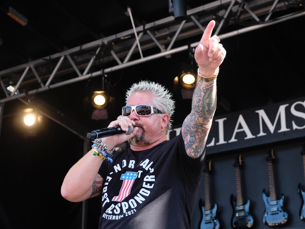 Guy Fieri gestures during an event with first responders while appearing on the Williams Sonoma culinary stage at the BottleRock Napa Valley music festival in Napa, Calif., Saturday, Sept. 4, 2021.
