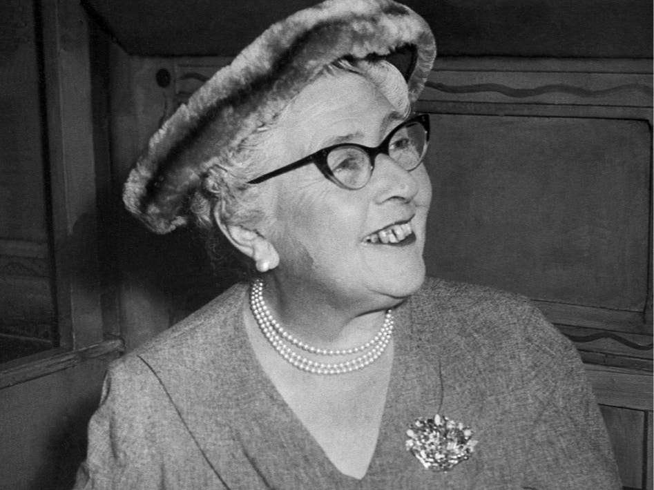 Mystery author Agatha Christie reads a telegram of congratulations from Noel Coward in a St. Martin's Lane restaurant, London, Sept. 12, 1957, the 1,990th performance of her play "The Mousetrap."