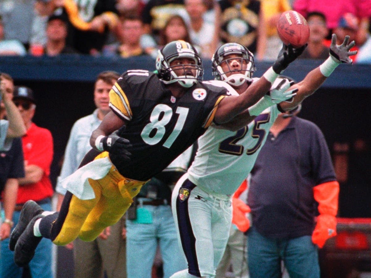 FILE - Pittsburgh Steelers wide receiver Charles Johnson (81) dives for a pass as Baltimore Ravens' DeRon Jenkins defends during an NFL football game in Pittsburgh on Oct. 18, 1998. Johnson's death was confirmed Wednesday. 