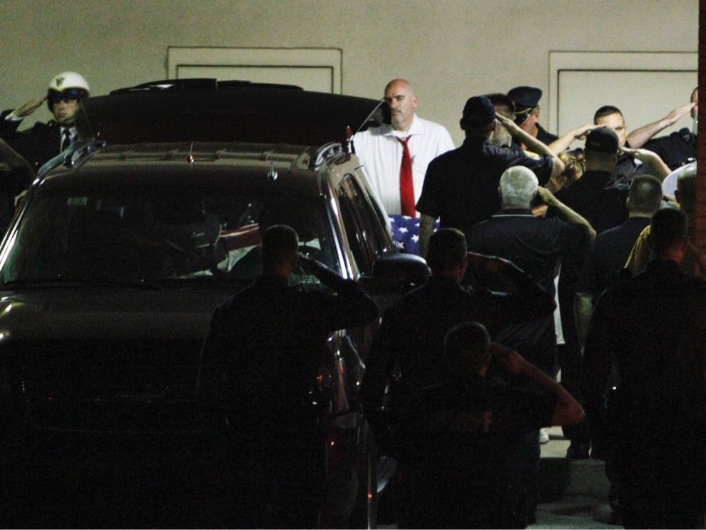 Police gather to salute the body of slain Plymouth Township canine officer Brad Fox, on Thursday Sept. 13, 2012, at Montgomery Hospital in Norristown Pa. Tuesday marks the 10th anniversary of his death. 