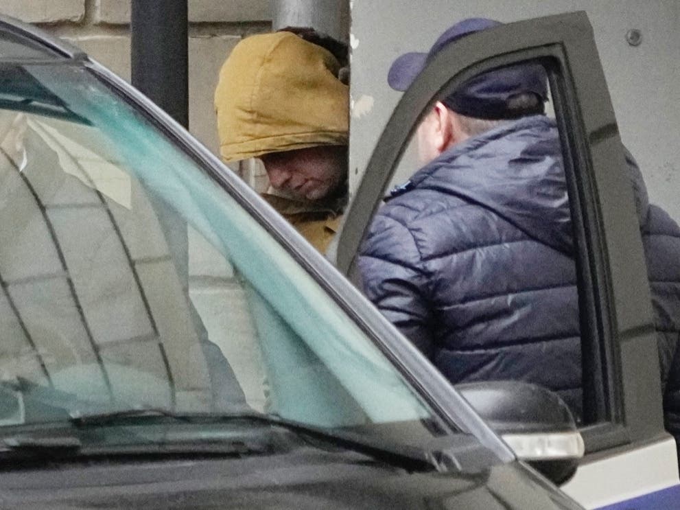 Wall Street Journal reporter Evan Gershkovich is escorted by officers from the Lefortovsky court to a bus, in Moscow, Russia, Thursday, March 30, 2023. 