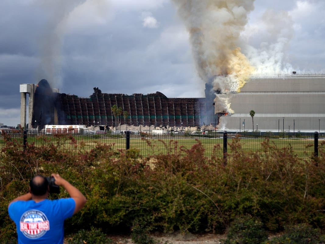A historic blimp hangar burns in Tustin on Tuesday, Nov. 7, 2023. A fire destroyed a massive World War II-era wooden hangar that was built to house military blimps based in Southern California.