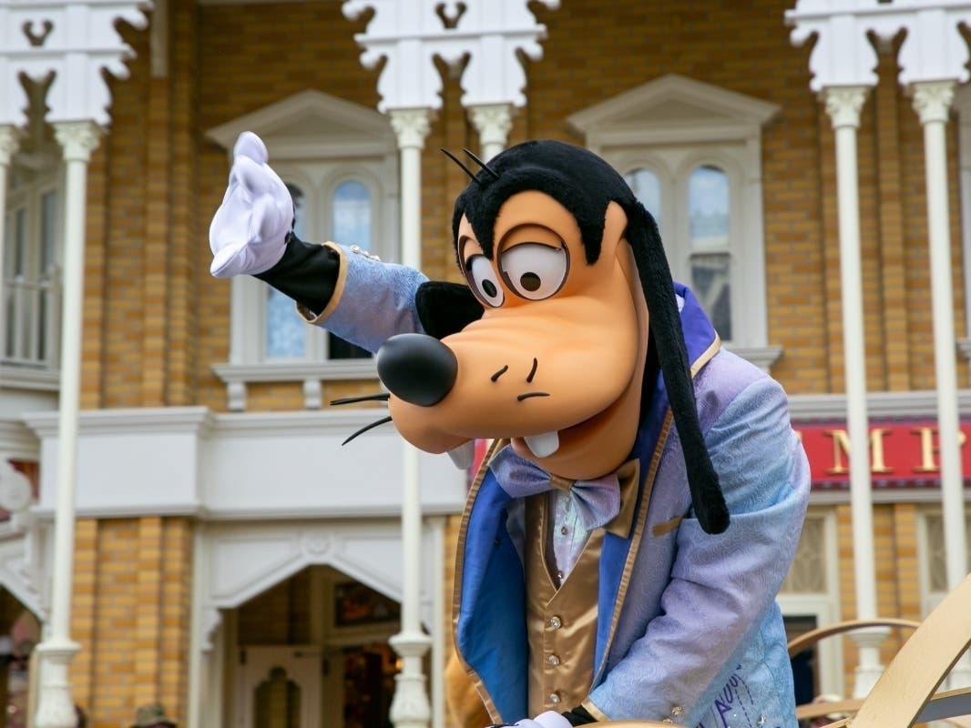 A performer dressed as Goofy entertains parade-goers at Magic Kingdom Park at Walt Disney World Resort in Lake Buena Vista, Florida, on Friday, April 22, 2022.
