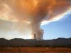 A plume of smoke created by the Airport Fire is seen on a mountain top Tuesday, Sept. 10, 2024, in Temescal Valley, Calif. 