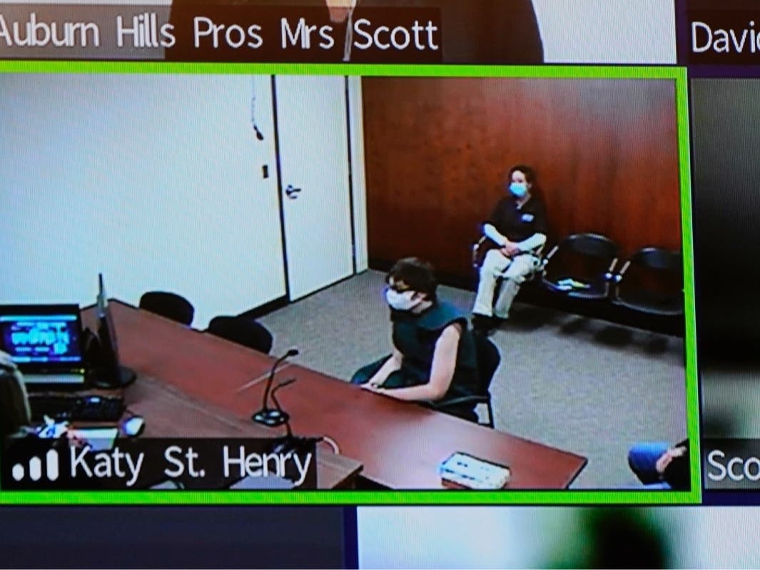 Ethan Crumbley, center, appears on a video arraignment at 52nd District Court in Rochester Hills, Mich., Wednesday, Dec. 1, 2021.