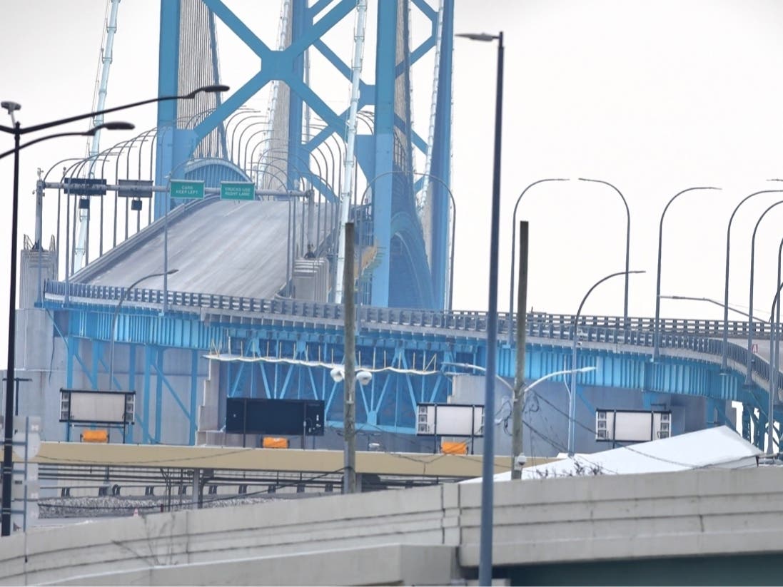 The Ambassador Bridge, that connects the U.S and Canada, is devoid of traffic on Tuesday, Feb. 8, 2022, in Detroit. Canadian lawmakers expressed increasing worry Tuesday about the economic effects of disruptive demonstrations.