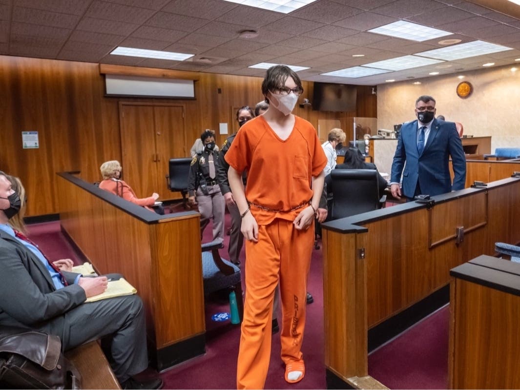 Ethan Crumbley is led away from the courtroom after a placement hearing Feb. 22 at Oakland County circuit court in Pontiac, Mich. Crumbley, 15, is charged with killing four fellow students and wounding seven others.