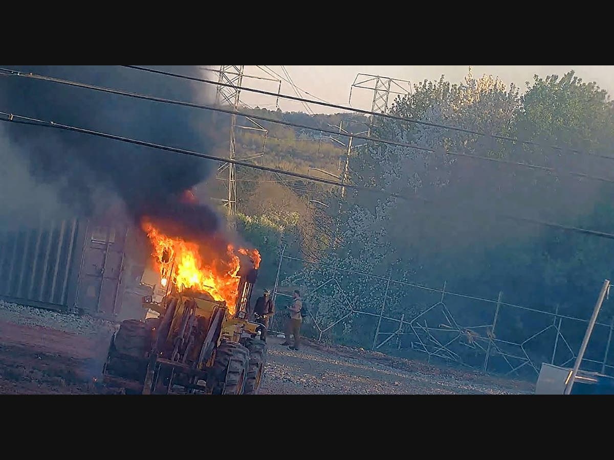 This image provided by the Atlanta Police Department shows construction equipment set on fire Saturday, March 4, 2023 by a group protesting the planned public safety training center, according to police. 