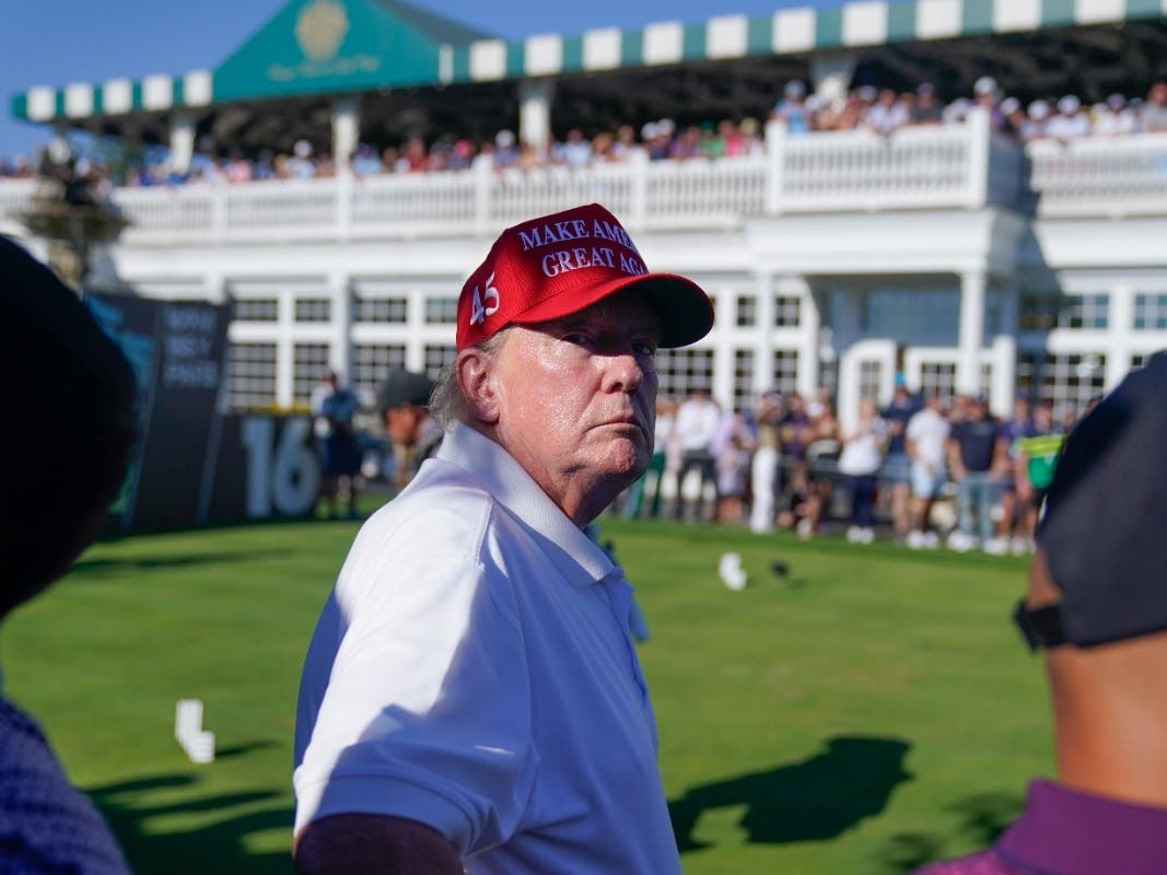 Former President Donald Trump looks over the crowd during the final round of the Bedminster Invitational LIV Golf tournament in Bedminster, N.J., Sunday, Aug. 13, 2023.