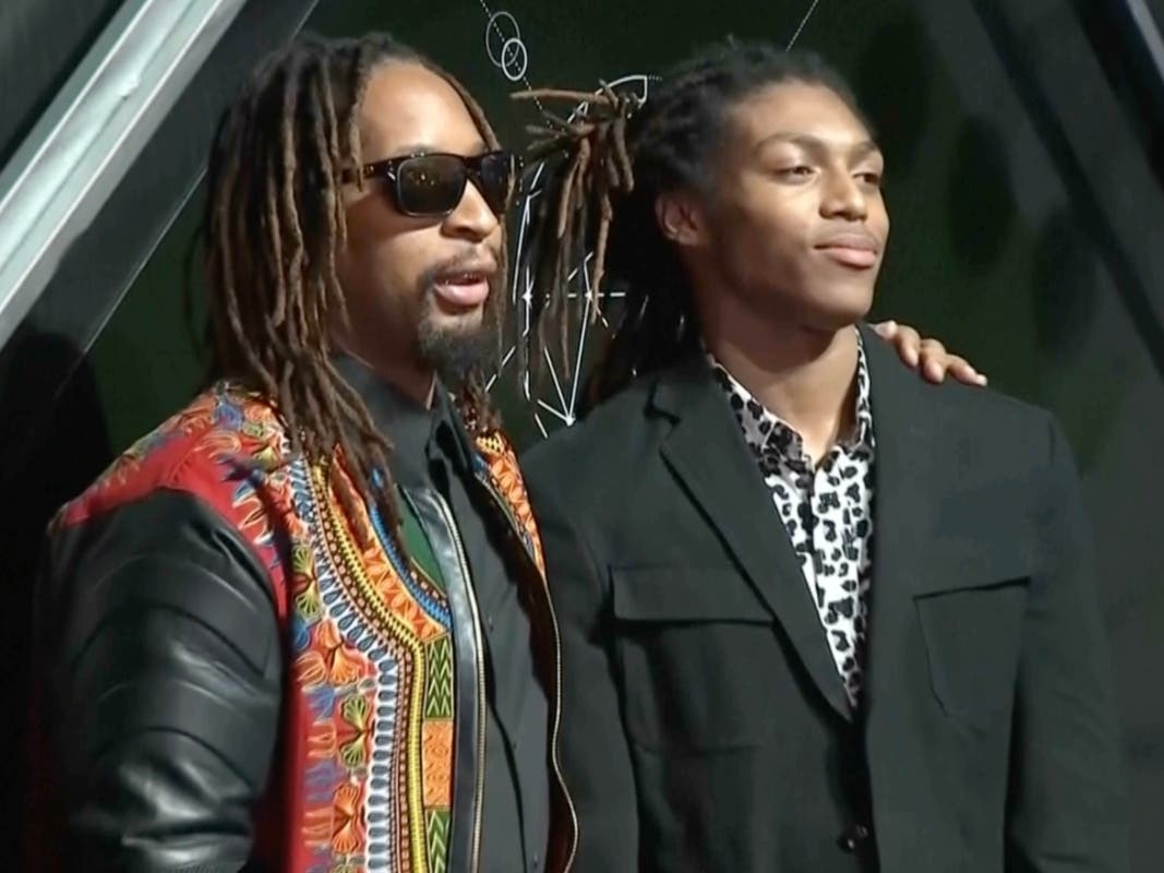 In this image from video, Lil Jon stands with his son, Nathan Smith, in New York, on Oct. 24, 2018.