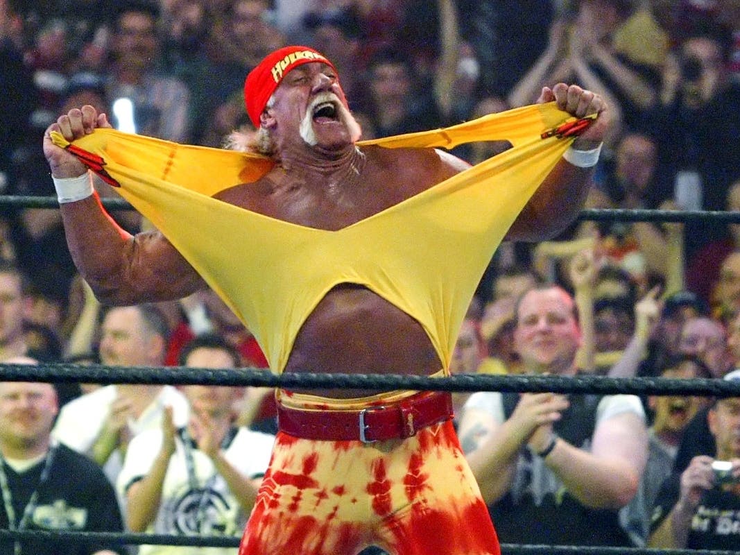 FILE - Famed wrestler Hulk Hogan fires up the crowd between matches during WrestleMania 21 in Los Angeles, April 3, 2005.