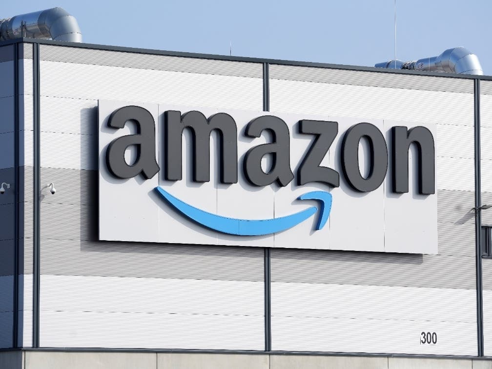FILE - An Amazon company logo marks the facade of a building, March 18, 2022, in Schoenefeld near Berlin.