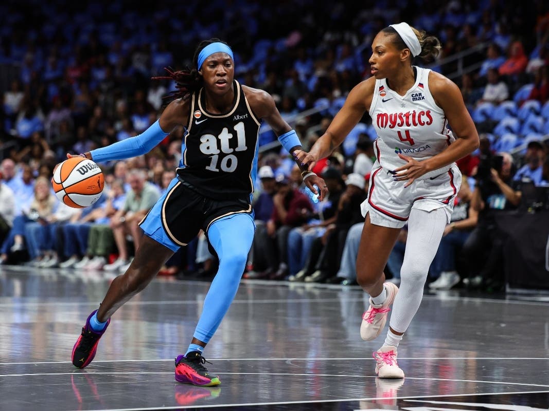 Atlanta Dream guard Rhyne Howard (10) dribbles against Washington Mystics guard Betnijah Laney-Hamilton (4) during the first half in Game 1 of an WNBA basketball first-round playoff series, Sunday, Sept. 27, 2026, in Atlanta.
