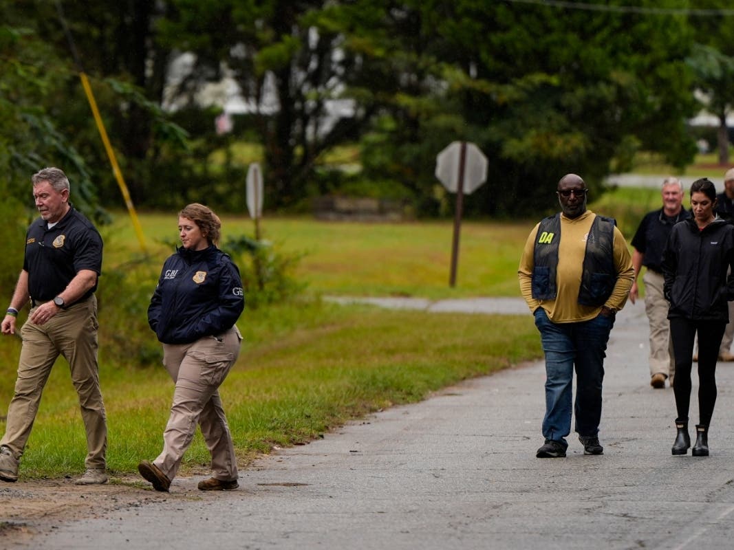 Authorities investigate the scene of a mass shooting where at least two people died and 35 were injured when struck by bullets Sunday morning, according to the Georgia Bureau of Investigation, Sunday, Oct. 4, 2026, in Vienna, Ga.