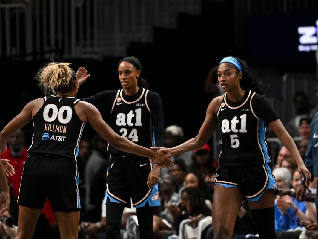 Atlanta forward Naz Hillmon (00) and Atlanta forward Angel Reese (5) high-five during the second half in Game 2 of the WNBA basketball semifinals against New York, Wednesday, Oct. 7, 2026, in Atlanta.