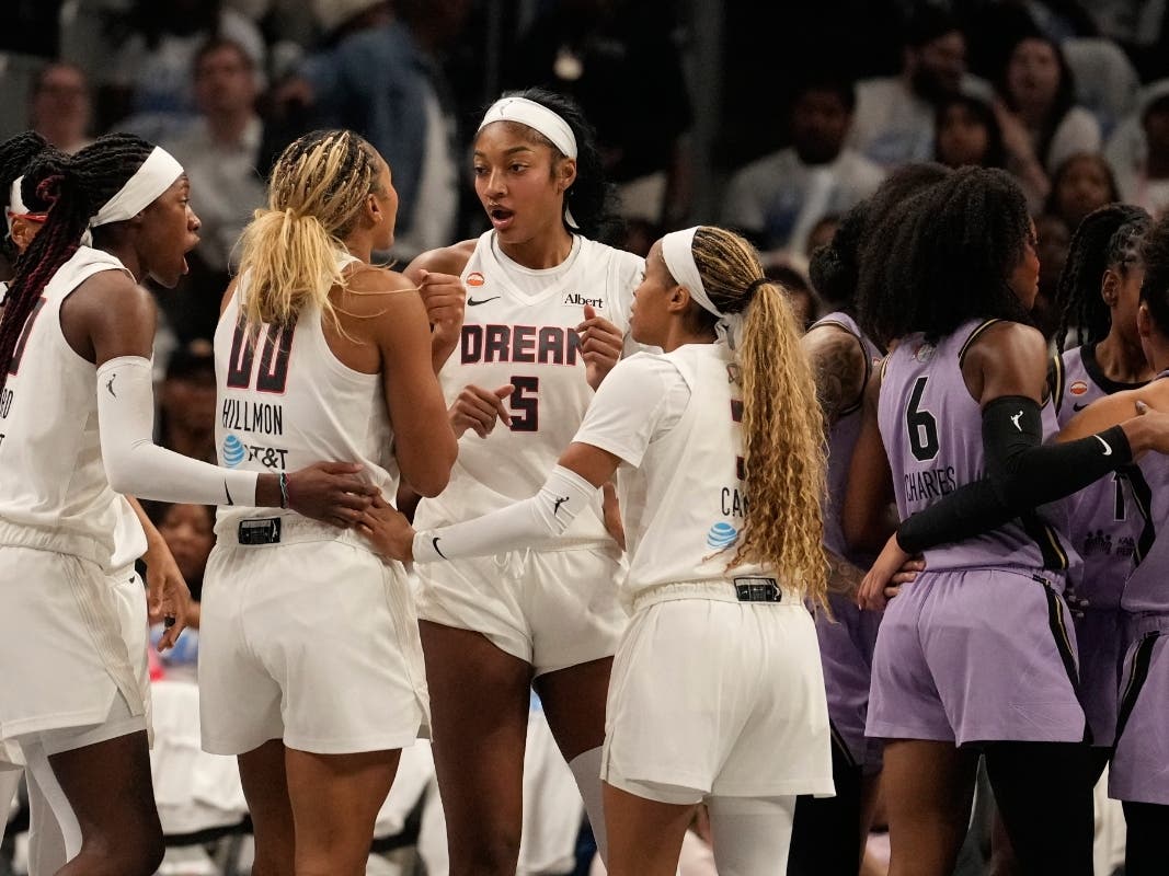 Atlanta Dream forward Angel Reese (5) and teammates talk on the court during Game 4 of the WNBA basketball finals against the Golden State Valkyries on Saturday, Oct. 24, 2026, in Atlanta.