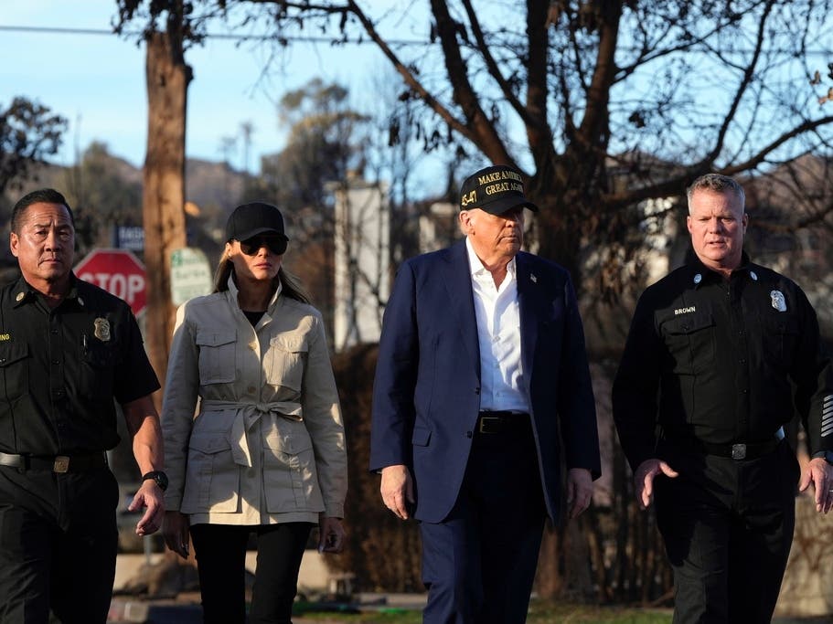 President Donald Trump and first lady Melania Trump walk with the Los Angles Fire Department's Chief Deputy of Emergency Services Jason Hing and Capt. Jeff Brown as they tour Pacific Palisades in January 2025.