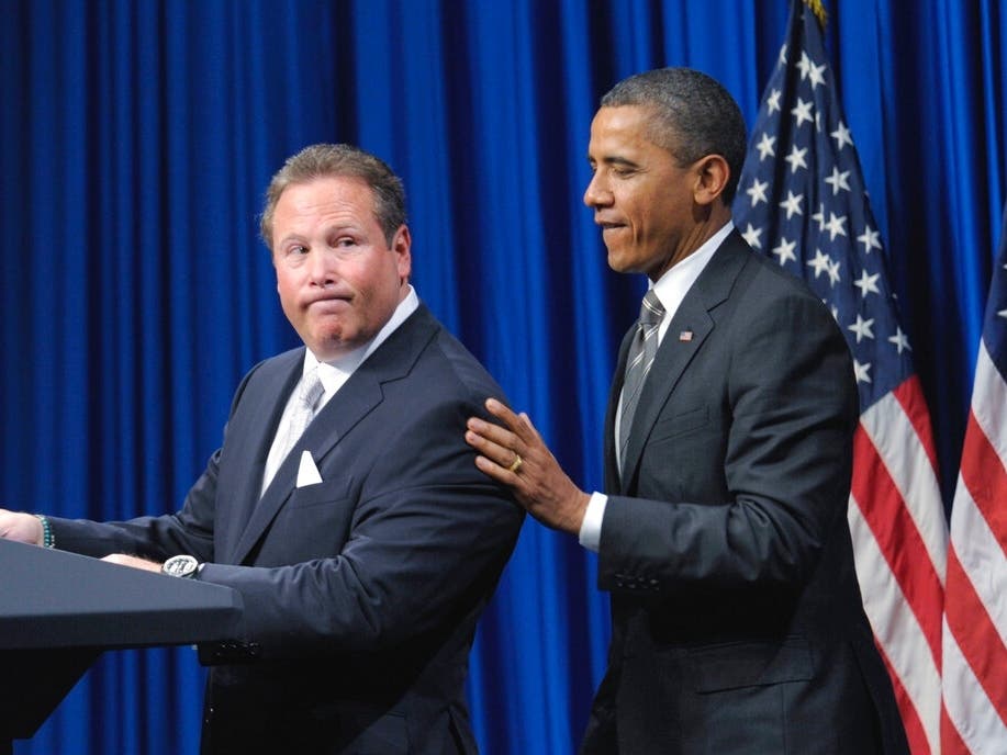 Stephen Cloobeck looks back at President Barack Obama during a 2011 fundraiser.