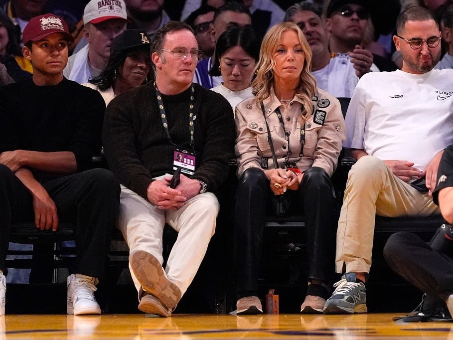 Jeanie Buss, second from left, watches a Lakers game with her husband Jay Mohr earlier this year.