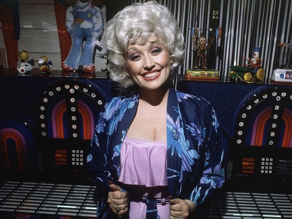 Singer and Actress Dolly Parton shown at a party following the premiere of her movie 'Nine to Five' in Los Angeles, Dec. 12, 1980.