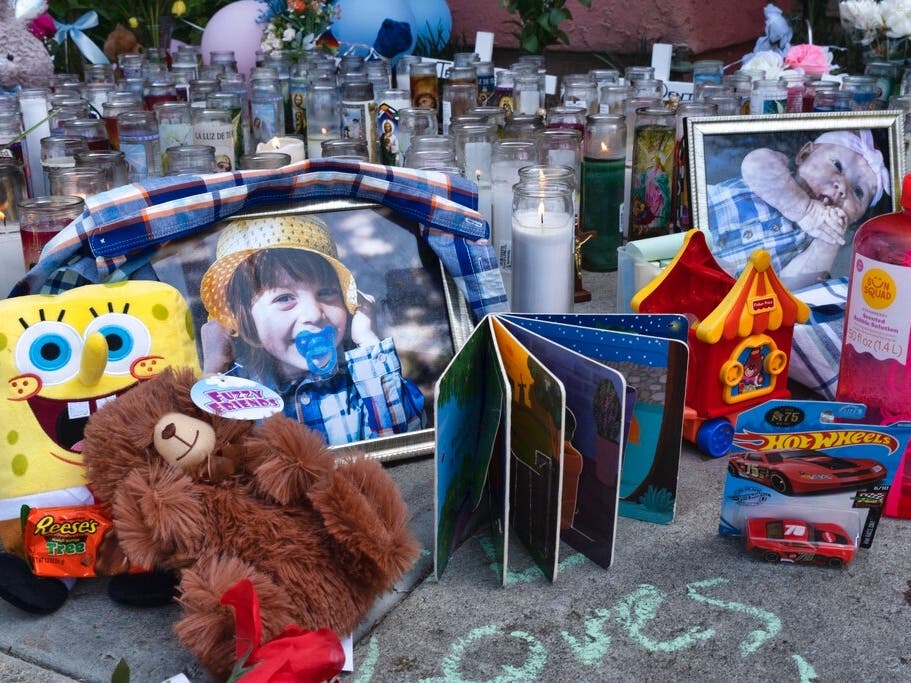 In this April 12, 2021, file photo, photos, candles, flowers and balloons are placed as a memorial for Liliana Carrillo's children.