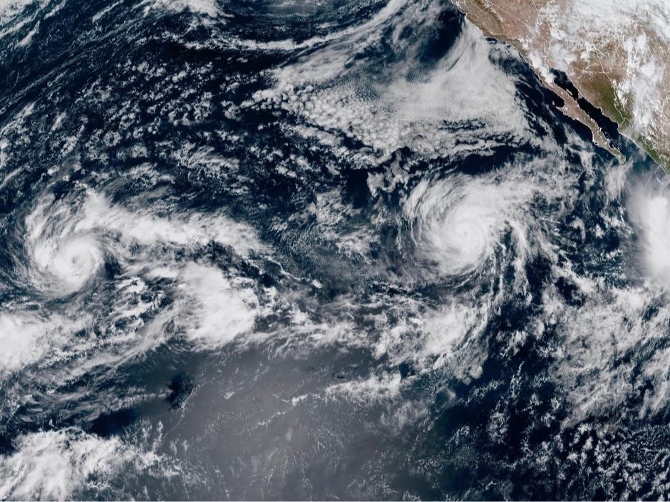 This satellite image provided by NOAA shows Tropical Storm Nolo, left, south of Hawaii; Hurricane Odalys, middle, and Hurricane Polo, right, off the coast of Mexico, in the Pacific Ocean on Thursday, Sept. 24, 2026.