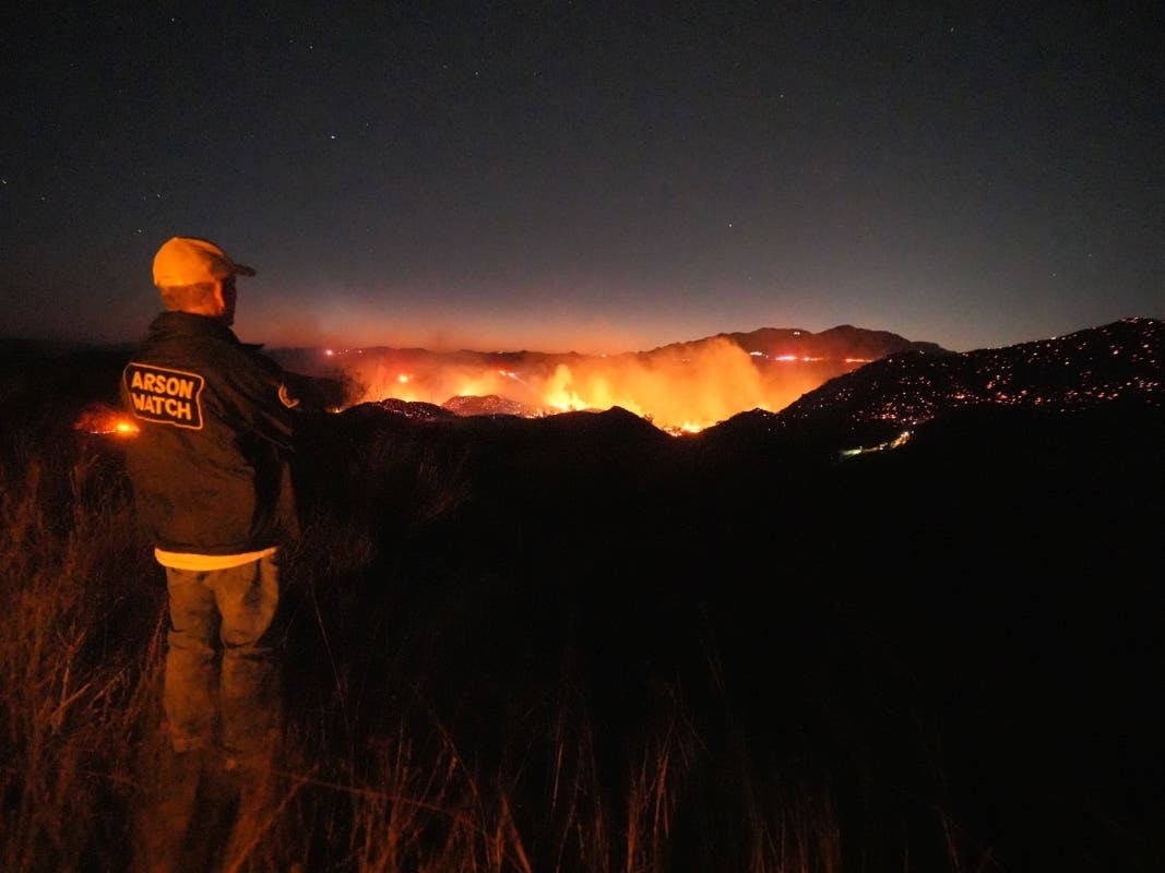 The Bryson Fire illuminates a ridge top on Thursday, Oct. 15, 2026, in Malibu.