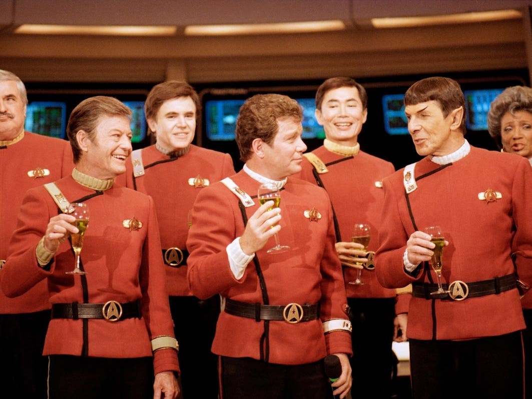 Members of the "Star Trek" crew, from left, James Doohan, DeForest Kelley, Walter Koenig, William Shatner, George Takei, Leonard Nimoy, and Nichelle Nichols, toast the newest "Star Trek" film at Paramount Studios on Dec. 28, 1988.