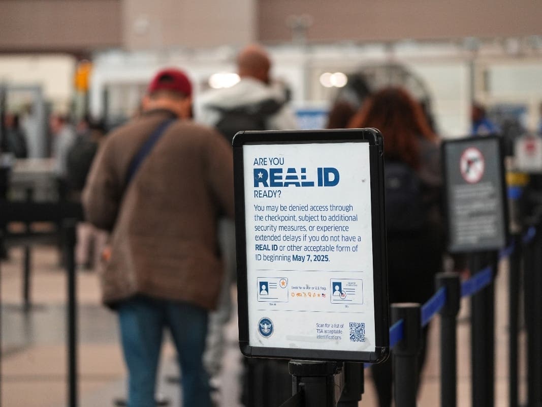 Sign displays need for passengers to produce Real ID documents at the south security checkpoint in Denver International Airport Wednesday, May 7, 2025, in Denver.