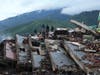 Residents search through the rubble of a building that collapsed in the earthquakes in La Guaira, Venezuela, Tuesday, June 30, 2026.